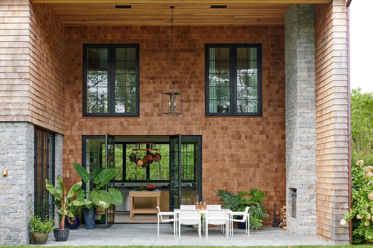 Covered porch with outdoor furniture by Richard Schultz for Knoll. 
