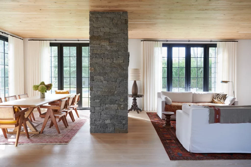 Sculptural double-sided fireplace that divides the living area.