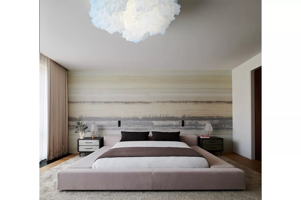 The primary suite centers on a Livin Divani Extra Wall bed by Piero Lissoni, which the designer set between Jasper end tables by Wüd Furniture and beneath an Ayala Serfaty chandelier from Maison Gerard.