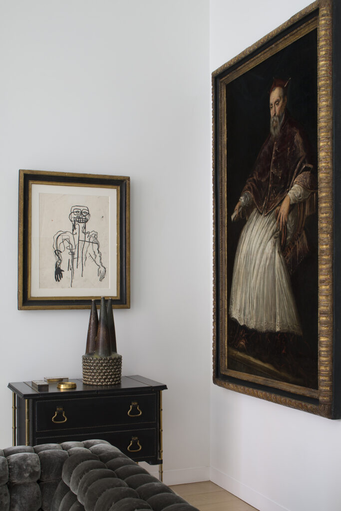 Drawing by Jean-Michel Basquiat and painting by Tintoretto flanked by a Jacques Adnet commode, on which sit three boxes by Line Vautrin and an Axel Salto ceramic.