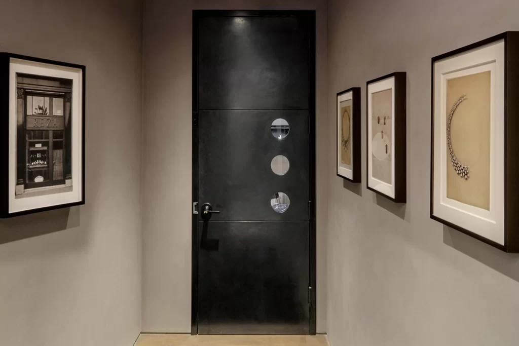 Mantrap and a steel door with three portholes.