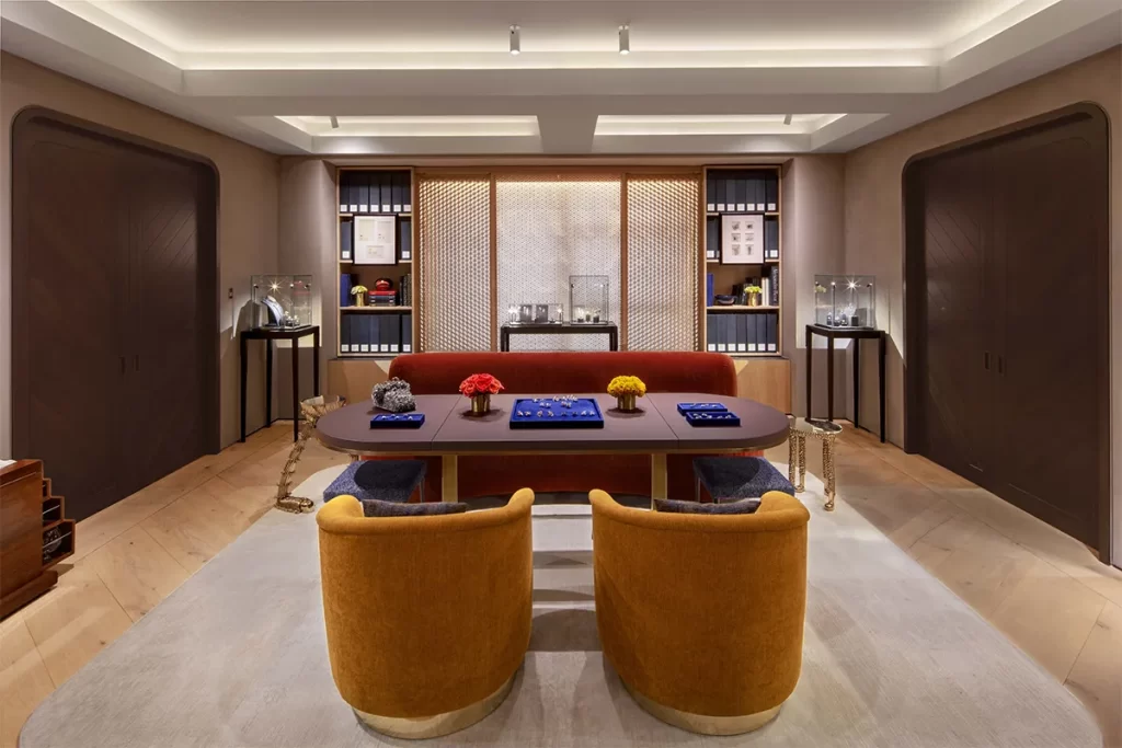 Central showroom formed by curved plaster walls and wide plank oak floors.