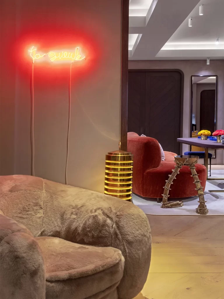 Above the Polar Chair from Edition Modern is a neon art by Claude Leveque.